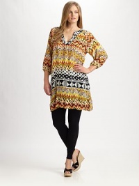 A tantalizing duo of tribal prints meets a relaxed-yet-flattering silhouette with an ultra-feminine ruffle hem. Split neckGathered three-quarter sleevesContrasting printsRuffle hemAbout 20 from natural waistSilkDry cleanImported A tantalizing duo of tribal prints meets a relaxed-yet-flattering silhouette with an ultra-feminine ruffle hem. Split neckGathered three-quarter sleevesContrasting printsRuffle hemAbout 20 from natural waistSilkDry cleanImported