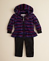 Juicy Couture updates the velour hoodie and pant look with vivid stripes and generous ruffle accents at the hem.