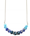 Mix and match with the seasonal colors on this chic Nine West necklace. The collar design boasts tonal blue beads and silver tone rondelles with crystal stone accents. Crafted in imitation rhodium-plated mixed metal. Approximate length: 16 inches + 2-inch extender.