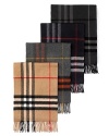 Soft, woven cashmere muffler with fringe in iconic check pattern.