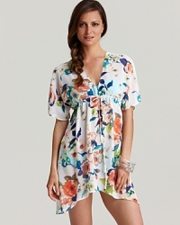 In a graphic floral print, Tommy Bahama's Beach Blossoms tunic coverup lends seaside sophistication. Hit the beach in this flowering layer for a ladylike look. In a graphic floral print, Tommy Bahama's Beach Blossoms tunic coverup lends seaside sophistication. Hit the beach in this flowering layer for a ladylike look.