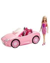 The Barbie® Glam Convertible is the perfect vehicle to make a statement and cruise around town in ultra-glam style! The two-seater features shiny metallic wheels, a signature pink-print interior, Barbie® logo license plate and holofoil lights. The Barbie® Glam Convertible is the perfect vehicle to make a statement and cruise around town in ultra-glam style! The two-seater features shiny metallic wheels, a signature pink-print interior, Barbie® logo license plate and holofoil lights.