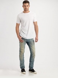 Deeply faded and distressed throughout the leg, this slim-fitting jean exudes effortless style with an edgy, downtown feel.Five-pocket styleInseam, about 33CottonMachine washMade in Italy Deeply faded and distressed throughout the leg, this slim-fitting jean exudes effortless style with an edgy, downtown feel.Five-pocket styleInseam, about 33CottonMachine washMade in Italy