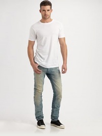 Deeply faded and distressed throughout the leg, this slim-fitting jean exudes effortless style with an edgy, downtown feel.Five-pocket styleInseam, about 33CottonMachine washMade in Italy