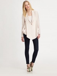 A lightweight blazer with an asymmetrical hem is a must-have casual cool spring look. Notched collarDropped shouldersLong sleeves with button cuffsSingle button front closureDual patch pocketsAsymmetrical hemAbout 20¾ from shoulder to hem90% rayon/10% nylonDry cleanImportedModel shown is 5'10 (177cm) wearing US size 4.