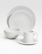 An elegantly detailed saucer is made entirely by hand in fine Limoges porcelain with a raised pearl border. From the Perlee White Collection Porcelain 6½ diam. Dishwasher safe Imported 