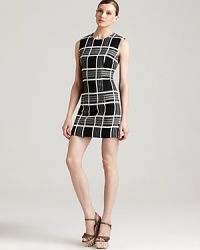 The classic tweed Rachel Roy dress gets an edgy modern makeover with an oversized check print and a short, slim silhouette. Play up the high hemline with lofty wedges. The classic tweed Rachel Roy dress gets an edgy modern makeover with an oversized check print and a short, slim silhouette. Play up the high hemline with lofty wedges.