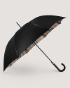 Stay warm, dry and stylish with a check-lined Burberry umbrella.