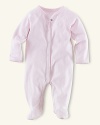 Ralph Lauren Childrenswear solid coverall. An adorable solid long-sleeved footed coverall in soft cotton jersey. Crew neckline, full ring-snap placket, fold-over detail at the cuffs. Ribbed neckline, placket and cuffs. Our signature satin logo patch accents the back neck.