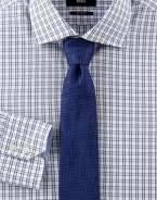 A clean, classic fit in fine cotton shirting with a blue-and-gray check pattern. ButtonfrontRegular fitSpread collarCottonDry cleanImported