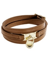 Vintage luggage-inspired chic, by Michael Kors. Crafted from triple-wrapped luggage brown leather with a padlock-inspired, gold tone brass accent. Approximate length: 25 inches. Vintage luggage-inspired chic, by Michael Kors. Crafted from triple-wrapped luggage brown leather with a padlock-inspired, gold tone brass accent. Approximate length: 25 inches.