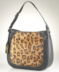 Get spotted with this hobo silhouette, featuring luxe leather and posh leopard-print haircalf for an altogether exotic look. It's spacious, pocket-lined and poised to meet your everyday demands. Get spotted with this hobo silhouette, featuring luxe leather and posh leopard-print haircalf for an altogether exotic look. It's spacious, pocket-lined and poised to meet your everyday demands.