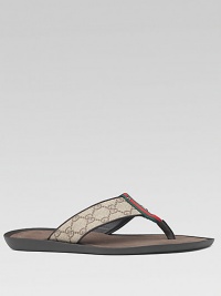 Thong sandal in GG plus fabric with leather trim and signature web. Rubber sole Made in ItalyPlease note: For best fit please size down one full size. Thong sandal in GG plus fabric with leather trim and signature web. Rubber sole Made in ItalyPlease note: For best fit please size down one full size.