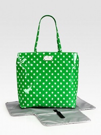 A mod, polka dot baby bag with matching changing pad for the stylish and sophisticated mom on-the-go.Double top handles, approximately 10 dropSpring clip strap top closeOne inside open pocketOne inside zip pocketWipe-clean liningPoplin-backed nylonApproximately 13½W X 12H X 10DImported