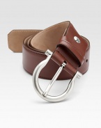 This distinguished style is rendered in luxe saddle leather with an adjustable design and shiny palladio gancini buckle.CalfskinPalladio buckleAbout 1½ wideMade in Italy