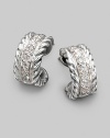 A striking curve of cabled sterling silver, with a center lane of pavé diamonds, gracefully hugs the ear. Diamonds, 0.24 tcw Sterling silver Diameter, about ½ Post back Imported