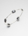 From the Rock Candy® Collection. Five faceted hematite doublet stations set on a hammered sterling silver bangle. Hematite doubletSterling silverDiameter, about 2.5Slip-on styleImported 