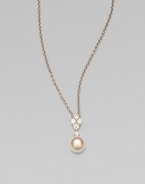 Five dazzling diamonds accent this round Akoya pearl pendant on a sleek 18k white gold link chain. 8MM white, round, Akoya pearlDiamonds, .35 tcwLength, about 18Pendant size, about 1¾ Lobster clasp closureImported 