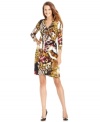 Calvin Klein's faux-wrap dress features an abstract, butterfly-inspired print and pretty tulip hem. (Clearance)