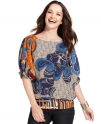 A bright mix of prints gives this floaty peasant blouse from ECI a bold, modern update. Pairing it with sleek black pants allows this eye-catching top to make a statement. A bright mix of prints gives this floaty peasant blouse from ECI a bold, modern update. Pairing it with sleek black pants allows this eye-catching top to make a statement.