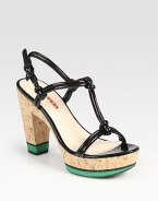 Knotted patent leather upper with a cork and micro-foam heel and platform. Cork and micro-foam heel, 4 (100mm)Cork and micro-foam platform, 1 (25mm)Compares to a 3 heel (75mm)Patent leather upperLeather liningRubber solePadded insoleImportedOUR FIT MODEL RECOMMENDS ordering one half size up as this style runs small. 