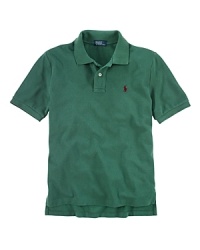 A classic polo shirt crafted from breathable cotton mesh is tailored in a short-sleeved silhouette for preppy, warm-weather style. A classic polo shirt crafted from breathable cotton mesh is tailored in a short-sleeved silhouette for preppy, warm-weather style.