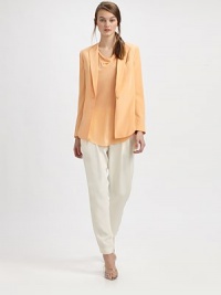A classic blazer look softened in pure silk, with the unexpected twist of a cropped back.CollarlessTapered lapelsOne welt chest pocketSingle-button closeLong sleeves with four-button cuffsWaist-length cropped backFully linedAbout 26 from shoulder to hemSilkDry cleanImported A classic blazer look softened in pure silk, with the unexpected twist of a cropped back.CollarlessTapered lapelsOne welt chest pocketSingle-button closeLong sleeves with four-button cuffsWaist-length cropped backFully linedAbout 26 from shoulder to hemSilkDry cleanImported