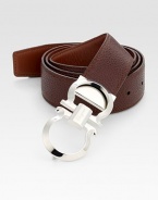 Smooth on one side and pebbled on the other, this reversible belt crafted in smooth Italian leather with double gancini buckle, will be a stylish, versatile addition to your existing wardrobe.LeatherAbout 2 wideMade in Italy