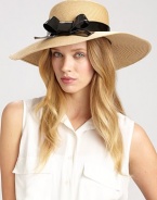 A charming design with a glossy bow accent to keep the sun out of your eyes. PolyesterBrim, about 4Imported