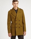 Fine Italian craftsmanship is represented in this outerwear classic, tailored in a superior wool blend with heritage-inspired details, finished in a streamlined, double-breasted silhouette.Button-frontNotch lapelShoulder epaulettesSide slash, waist flap pocketsRear beltFully linedAbout 33 from shoulder to hem80% virgin wool/20% polyamideDry cleanMade in Italy