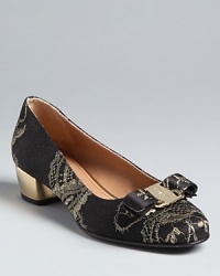 These incredibly elegant Salvatore Ferragamo pumps channel 17th century era, aristocratic touches, in tapestry lace with shining metallic heels. They are certainly fit for a queen. These incredibly elegant Salvatore Ferragamo pumps channel 17th century era, aristocratic touches, in tapestry lace with shining metallic heels. They are certainly fit for a queen.