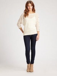 Striped slub-knit draped from shoulder to hem in an easy-fit dolman pullover.BoatneckDropped shouldersSlit button-down dolman sleevesDraped bodiceCamisole includedAbout 29 from shoulder to hemPolyesterDry cleanMade in USAModel shown is 5'8½ (174cm) wearing US size Small. Striped slub-knit draped from shoulder to hem in an easy-fit dolman pullover.BoatneckDropped shouldersSlit button-down dolman sleevesDraped bodiceCamisole includedAbout 29 from shoulder to hemPolyesterDry cleanMade in USAModel shown is 5'8½ (174cm) wearing US size Small.