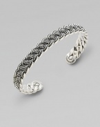 A bold accent crafted in sterling silver with a woven design that lends immediate texture. Sterling silver0.375 wideImported