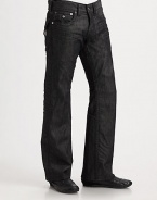 A relaxed fit with modern sensibilities, rendered with stitched flap pockets and occasional wrinkles in washed black denim. Five-pocket styleStitched flap back pocketsInseam, about 34CottonMachine washMade in USA 