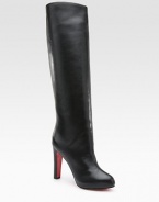 Lustrous leather knee-high style with a covered heel and platform. Self-covered heel, 4 (100mm) Covered platform, ¾ (20mm) Compares to a 3¼ heel (80mm) Shaft, 17 Leg circumference, 14 Leather upper Pull-on style Leather lining Signature red leather sole Padded insole Made in Italy