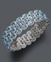 Boldly express yourself in blue. This three-row cuff bracelet features 33 carats of oval-cut blue topaz set in stunning sterling silver. Approximate length: 7-1/2 inches.