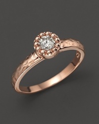 Faceted diamond set in a textured 14K. rose gold band.