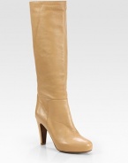 Step out in this notice-me silhouette of creamy leather, propped with a platform and tall heel. Self-covered heel, 3¾ (95mm)Hidden platform, ½ (15mm)Compares to a 3¼ heel (80mm)Shaft, 16¼Leg circumference, 14Leather upperPull-on styleLeather lining and solePadded insoleImportedOUR FIT MODEL RECOMMENDS ordering one half size up as this style runs small. 