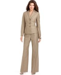 Classic herringbone looks fresh on Evan Picone's streamlined suit, featuring a shawl-collar jacket and wide-leg pants. Classic herringbone looks fresh on Evan Picone's streamlined suit, featuring a shawl-collar jacket and wide-leg pants.