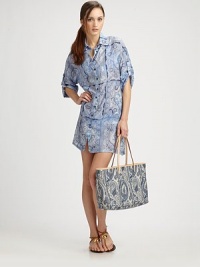 An airy paisley coverup with button-tab sleeves and a relaxed fit.Pointed collarButton frontButton-tab three-quarter sleeves70% cotton/30% silkMade in Italy An airy paisley coverup with button-tab sleeves and a relaxed fit.Pointed collarButton frontButton-tab three-quarter sleeves70% cotton/30% silkMade in Italy