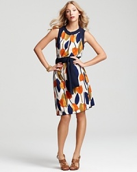 A artful tulip pattern flourishes on this flowing Tory Burch dress, designed with a solid sash at the waist to carve a covetable silhouette. A artful tulip pattern flourishes on this flowing Tory Burch dress, designed with a solid sash at the waist to carve a covetable silhouette.