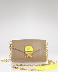 Tory Burch's ultra-soft leather wallet adds a double dose of chic. It features a removable shoulder strap and plenty of slots for your tiniest treasures. Tory Burch's ultra-soft leather wallet adds a double dose of chic. It features a removable shoulder strap and plenty of slots for your tiniest treasures.