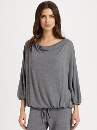 Flowy silhouette, impeccably constructed for a relaxed and comfortable fit. Draped boatneckThree-quarter length batwing sleeves with banded cuffsElastic waistPull-on style53% polyamide/47% woolMachine washImported