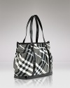 Tote all your baby essentials in a stylish check tote from Burberry.