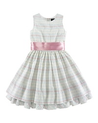 A charmingly traditional dress in multi-striped cotton seersucker has a pretty, full skirt with a petticoat and ribbon sash. A charmingly traditional dress in multi-striped cotton seersucker has a pretty, full skirt with a petticoat and ribbon sash.