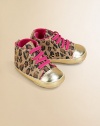 Baby takes a walk on the wild side in these eye-catching, metallic-accented canvas kicks with contrasting laces and leopard print design.Slip-onCanvas upperVelvet liningPolyurethane solePadded insoleImported