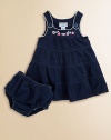 The look of denim in soft, stretch French terry with delicate scalloped trim and sweet embroidered flowers.U-shaped necklineButton strapsScalloped edgingFloral embroidered yokeTiered, flared bodyMatching panty with elasticized waist and leg openings96% cotton/4% spandexMachine washImported