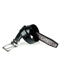A burnished silvertone buckle finishes a handsome croc-embossed belt that easily reverses from black to brown leather. A burnished silvertone buckle finishes a handsome croc-embossed belt that easily reverses from black to brown leather.