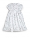 THE LOOKSweet garden roses printRound necklinePintucked center insetShort sleeves with banded cuffsSeamed Empire waistPicot trimmed neckline, inset, cuffs, waist and hemRuffle hemBack snapsTHE MATERIALPima cottonCARE & ORIGINMachine washImported