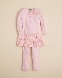 A ruffled lace hem, lace bow and puff sleeves add girlie flair to this top and legging set. A ruffled lace hem, lace bow and puff sleeves add girlie flair to this top and legging set.